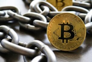 Bitcoin coins intertwined with a metal chain, symbolizing cryptocurrency and blockchain security.